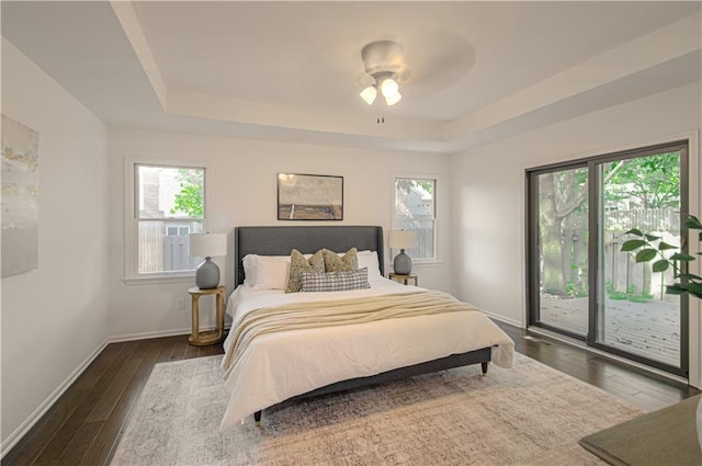 4300 W 112th St, Leawood, KS 66211 - bedroom featuring access to outside, a raised ceiling, dark wood-style flooring, and baseboards
