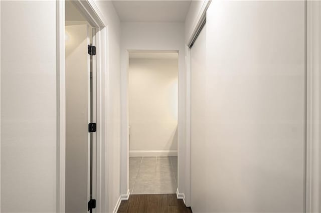 4300 W 112th St, Leawood, KS 66211 - corridor featuring baseboards and dark wood-style flooring