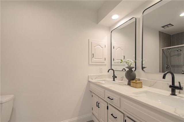 4300 W 112th St, Leawood, KS 66211 - full bath featuring toilet, double vanity, recessed lighting, tiled shower, and baseboards