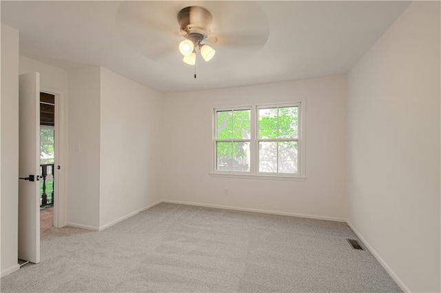 4300 W 112th St, Leawood, KS 66211 - spare room with light colored carpet, ceiling fan, and baseboards