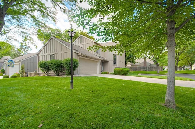 4300 W 112th St, Leawood, KS 66211 - view of front of property featuring board and batten siding, a garage, driveway, and a front lawn