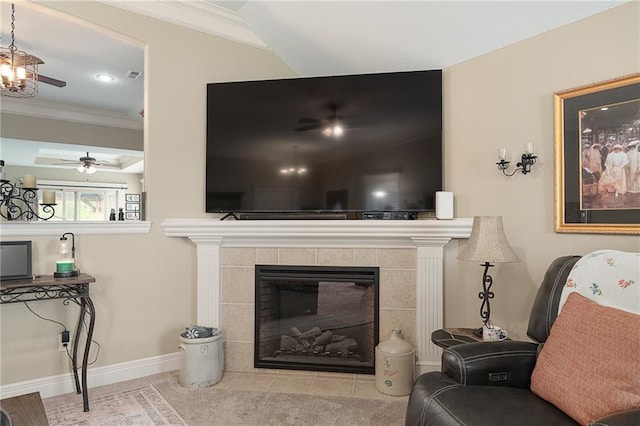 1611 NW Creekland Dr, Grain Valley, MO 64029 - living room featuring crown molding, ceiling fan, a tile fireplace, and baseboards