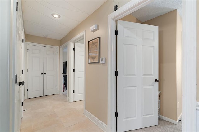 1611 NW Creekland Dr, Grain Valley, MO 64029 - hall with baseboards, recessed lighting, and light tile patterned flooring