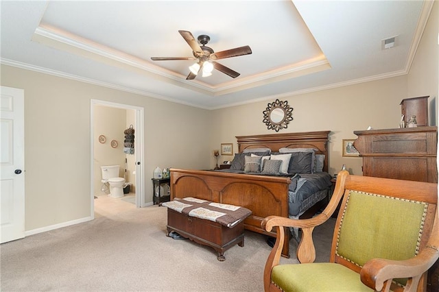 1611 NW Creekland Dr, Grain Valley, MO 64029 - bedroom featuring a tray ceiling, crown molding, light colored carpet, baseboards, and ensuite bathroom