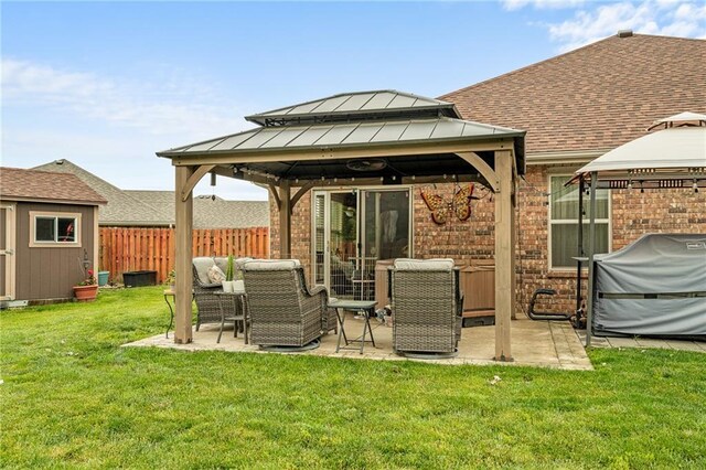 1611 NW Creekland Dr, Grain Valley, MO 64029 - rear view of house featuring a gazebo, brick siding, outdoor lounge area, and roof with shingles