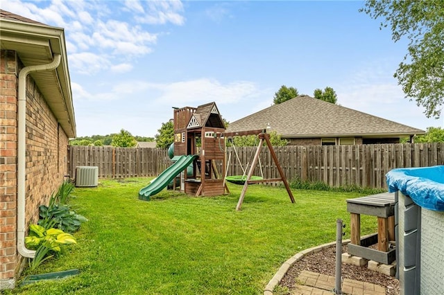 1611 NW Creekland Dr, Grain Valley, MO 64029 - view of yard featuring a playground and central AC