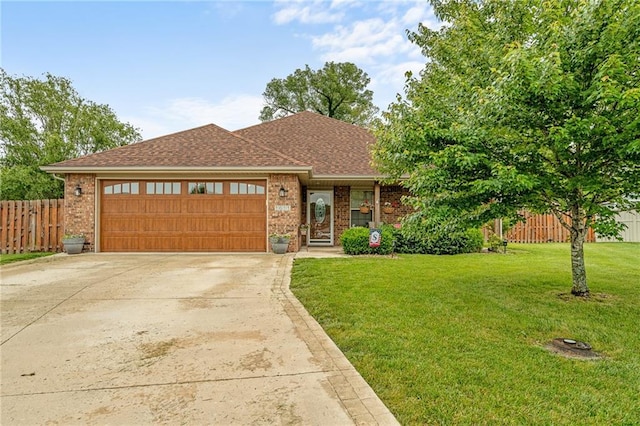 1611 NW Creekland Dr, Grain Valley, MO 64029 - view of front facade featuring a garage, brick siding, driveway, and roof with shingles