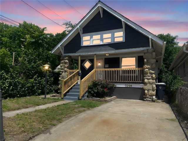 3208 E 31st St, Kansas City, MO 64128 - view of front of property with a porch
