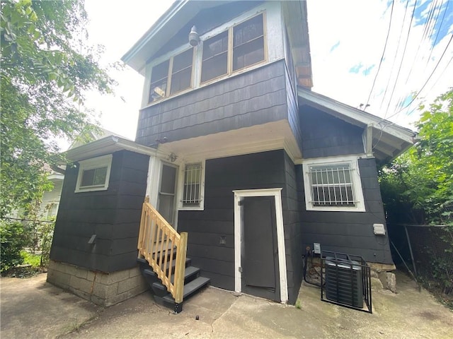 3208 E 31st St, Kansas City, MO 64128 - rear view of property featuring entry steps