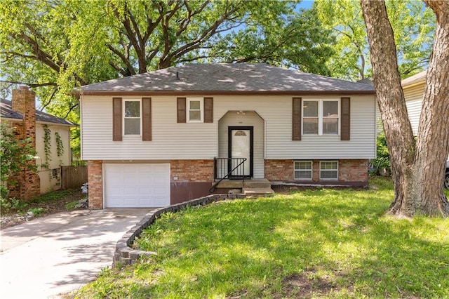 5317 NE 46th St, Kansas City, MO 64117 - bi-level home featuring brick siding, a garage, driveway, and a front lawn