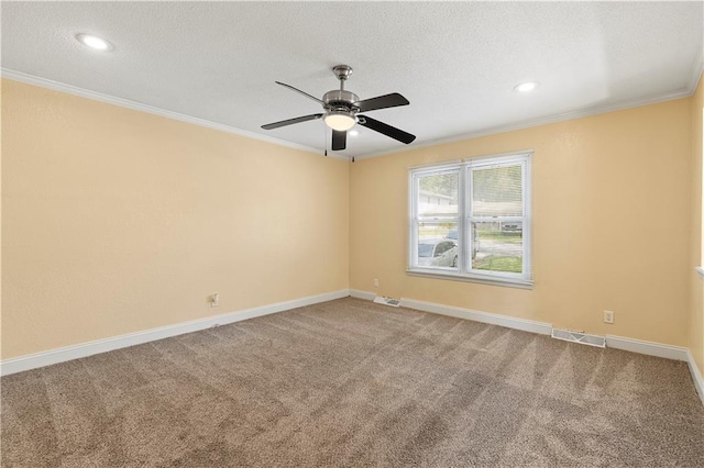 5317 NE 46th St, Kansas City, MO 64117 - carpeted spare room with ornamental molding, ceiling fan, baseboards, a textured ceiling, and recessed lighting