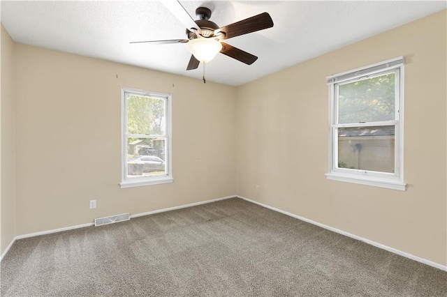 5317 NE 46th St, Kansas City, MO 64117 - empty room with carpet flooring, ceiling fan, and baseboards