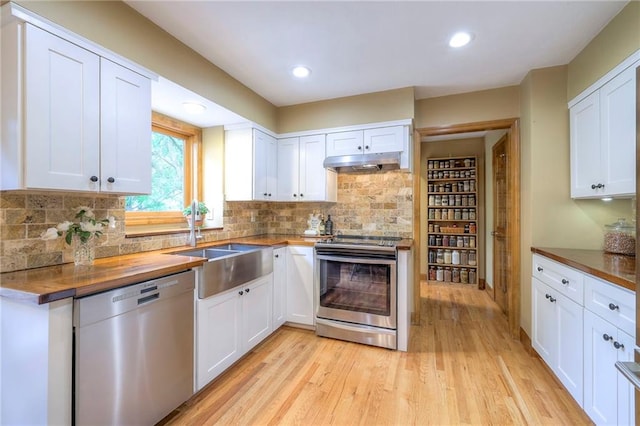15243 Long St, Overland Park, KS 66221 - kitchen with appliances with stainless steel finishes, under cabinet range hood, light wood-type flooring, white cabinets, and a sink