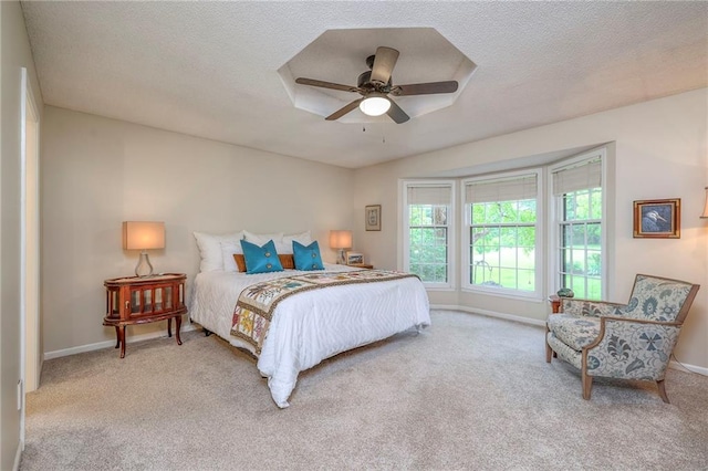 15243 Long St, Overland Park, KS 66221 - bedroom featuring carpet, baseboards, a textured ceiling, and a ceiling fan