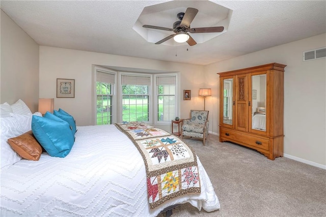 15243 Long St, Overland Park, KS 66221 - bedroom featuring carpet flooring, a ceiling fan, a textured ceiling, and baseboards