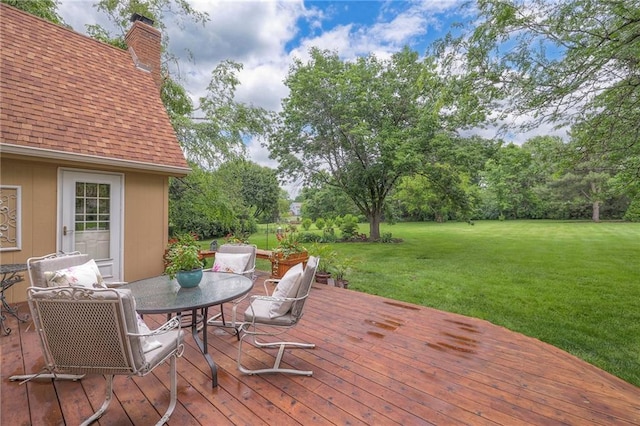 15243 Long St, Overland Park, KS 66221 - deck featuring a yard and outdoor dining space