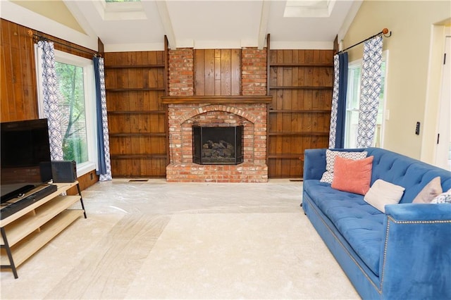 204 NW Redwood Ct, Lees Summit, MO 64064 - living room featuring a fireplace, carpet, and wooden walls