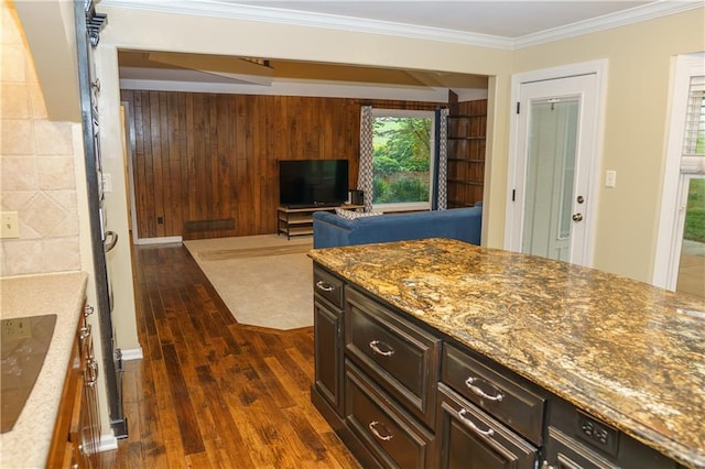 204 NW Redwood Ct, Lees Summit, MO 64064 - kitchen featuring dark wood-style floors, stone counters, and ornamental molding