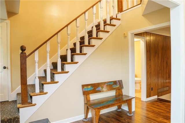 204 NW Redwood Ct, Lees Summit, MO 64064 - stairs featuring wood finished floors and baseboards