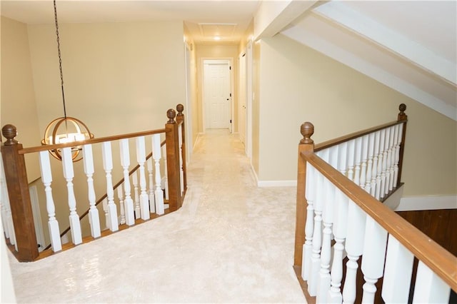204 NW Redwood Ct, Lees Summit, MO 64064 - corridor featuring an upstairs landing, carpet floors, a chandelier, and attic access