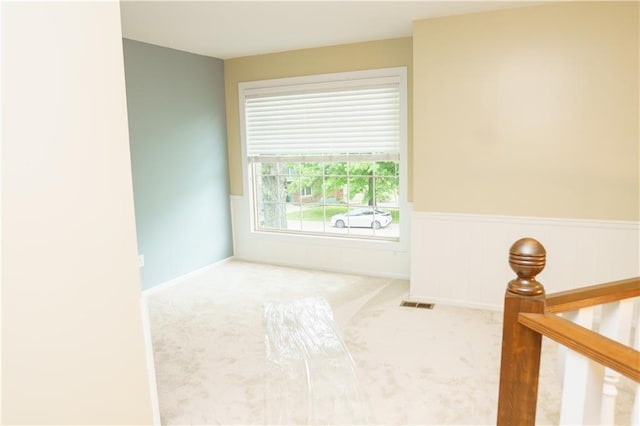 204 NW Redwood Ct, Lees Summit, MO 64064 - spare room with carpet flooring and wainscoting