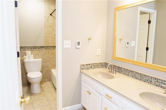 204 NW Redwood Ct, Lees Summit, MO 64064 - bathroom featuring double vanity, tile walls, tile patterned floors, bathtub / shower combination, and tasteful backsplash