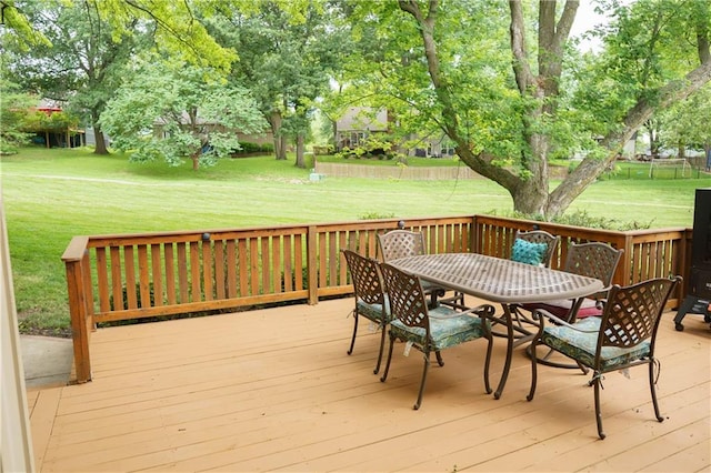 204 NW Redwood Ct, Lees Summit, MO 64064 - wooden terrace featuring outdoor dining space and a lawn