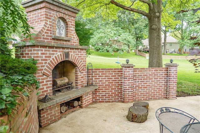 204 NW Redwood Ct, Lees Summit, MO 64064 - view of patio / terrace with an outdoor brick fireplace