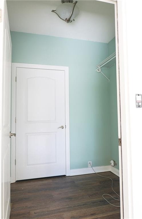 2404 Edmonds Ct, Columbia, MO 65203 - laundry room featuring dark wood-style floors and baseboards