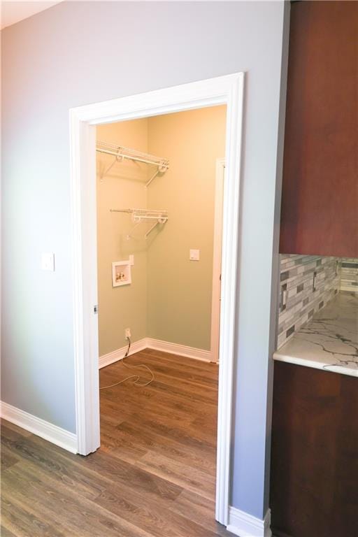 2404 Edmonds Ct, Columbia, MO 65203 - laundry room with dark wood-type flooring, baseboards, and washer hookup