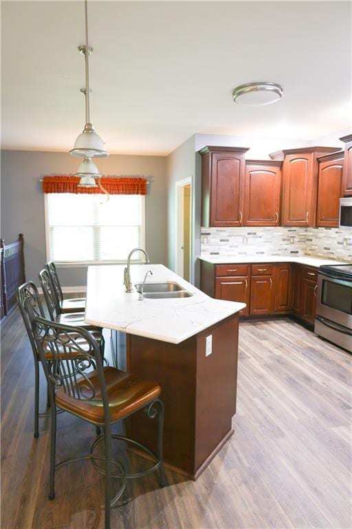 2404 Edmonds Ct, Columbia, MO 65203 - kitchen with a sink, stainless steel electric range oven, white microwave, and light wood-style floors