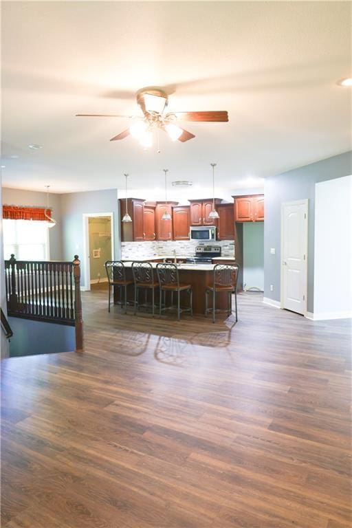 2404 Edmonds Ct, Columbia, MO 65203 - kitchen featuring stainless steel appliances, baseboards, decorative backsplash, and decorative light fixtures