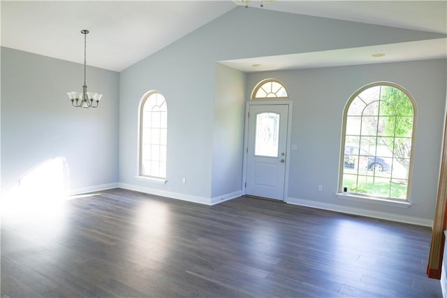 2404 Edmonds Ct, Columbia, MO 65203 - foyer entrance with vaulted ceiling, a chandelier, plenty of natural light, and dark wood finished floors