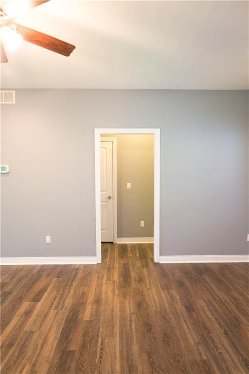2404 Edmonds Ct, Columbia, MO 65203 - empty room with a ceiling fan, dark wood-style flooring, and baseboards