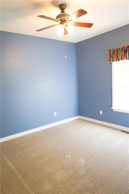 2404 Edmonds Ct, Columbia, MO 65203 - empty room with a ceiling fan, carpet floors, and baseboards