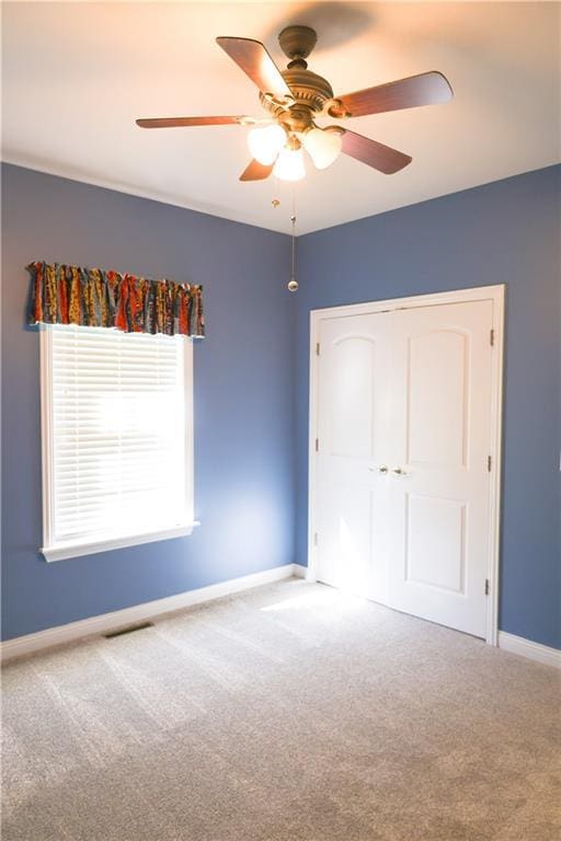 2404 Edmonds Ct, Columbia, MO 65203 - unfurnished bedroom with carpet flooring, baseboards, a closet, and ceiling fan