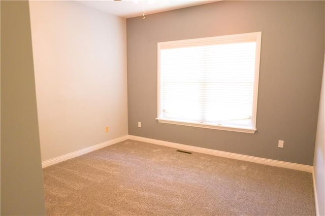 2404 Edmonds Ct, Columbia, MO 65203 - spare room featuring carpet, baseboards, and ceiling fan