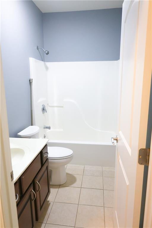 2404 Edmonds Ct, Columbia, MO 65203 - full bathroom featuring vanity, tile patterned floors, toilet, and washtub / shower combination