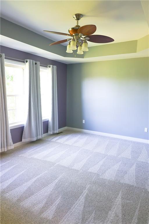 2404 Edmonds Ct, Columbia, MO 65203 - empty room featuring baseboards, carpet floors, and a ceiling fan