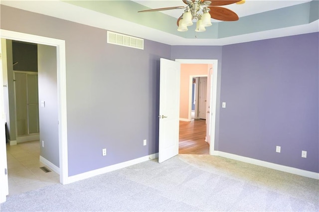2404 Edmonds Ct, Columbia, MO 65203 - unfurnished bedroom featuring baseboards, light carpet, and ceiling fan
