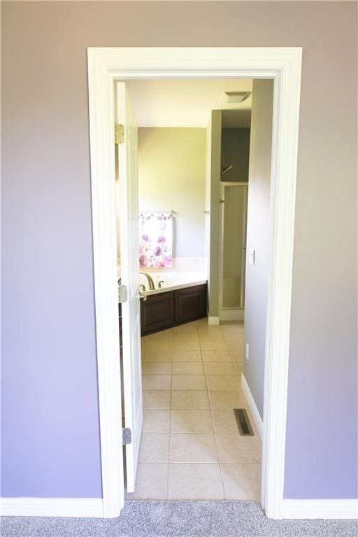 2404 Edmonds Ct, Columbia, MO 65203 - corridor featuring light tile patterned flooring and baseboards