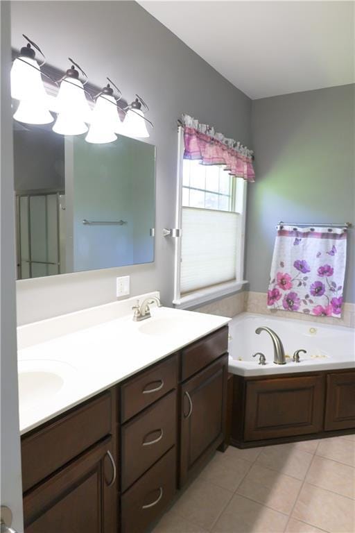 2404 Edmonds Ct, Columbia, MO 65203 - bathroom featuring tile patterned flooring, double vanity, and a whirlpool tub
