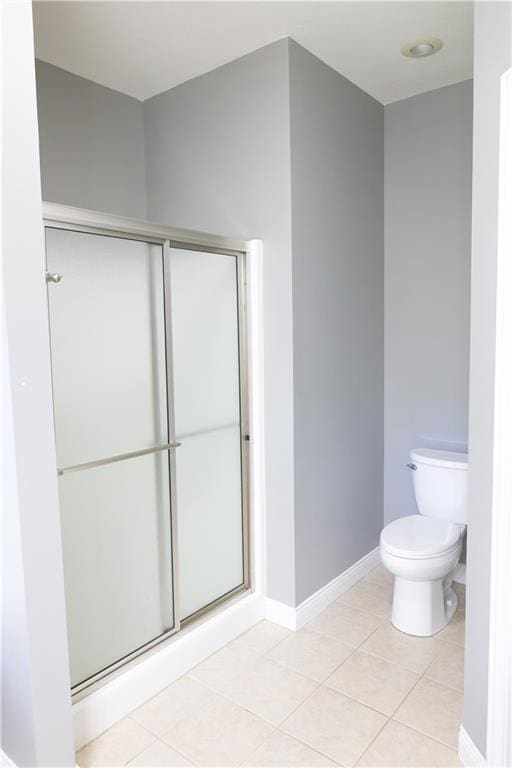 2404 Edmonds Ct, Columbia, MO 65203 - full bathroom featuring toilet, baseboards, a stall shower, and tile patterned floors