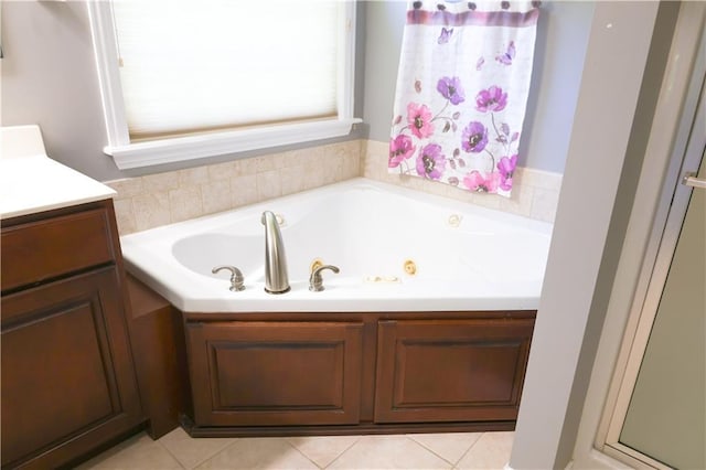 2404 Edmonds Ct, Columbia, MO 65203 - bathroom with a tub with jets, vanity, and tile patterned flooring