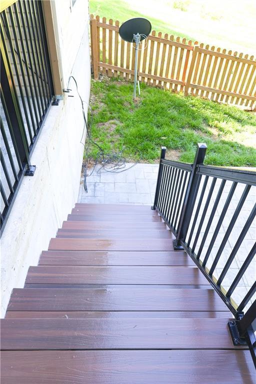 2404 Edmonds Ct, Columbia, MO 65203 - wooden deck with a fenced backyard