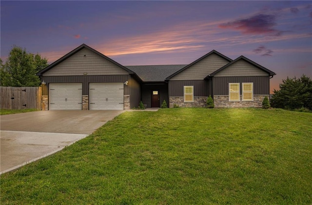 151 SE 225th Rd, Warrensburg, MO 64093 - view of front of property with stone siding, driveway, and a garage