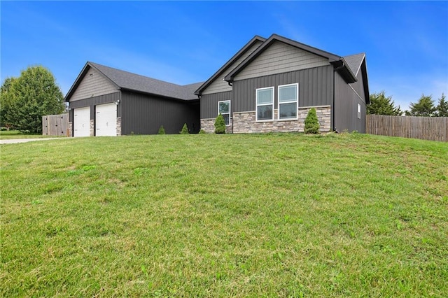 151 SE 225th Rd, Warrensburg, MO 64093 - ranch-style house with stone siding, a garage, and board and batten siding