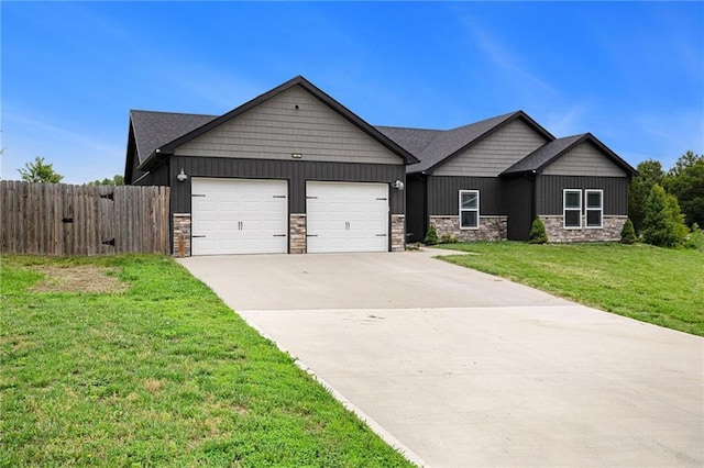 151 SE 225th Rd, Warrensburg, MO 64093 - view of front facade featuring stone siding, a garage, concrete driveway, and board and batten siding