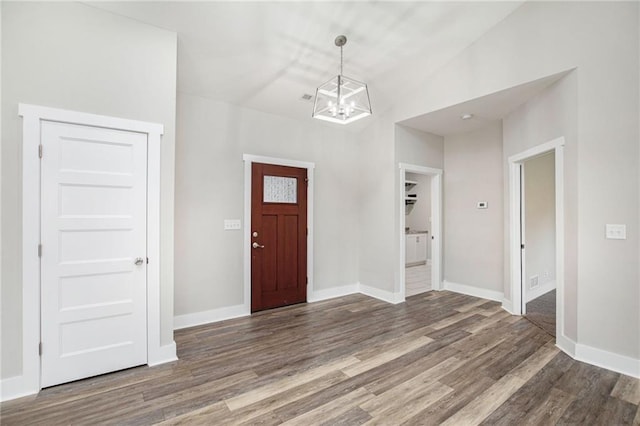 151 SE 225th Rd, Warrensburg, MO 64093 - entryway featuring a chandelier, wood finished floors, and baseboards