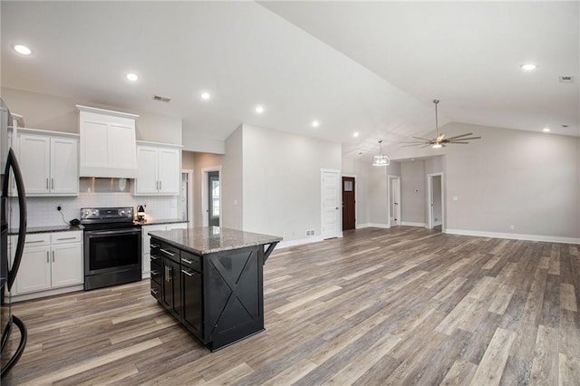 151 SE 225th Rd, Warrensburg, MO 64093 - kitchen featuring black range with electric cooktop, a kitchen island, ceiling fan, light wood-type flooring, and vaulted ceiling